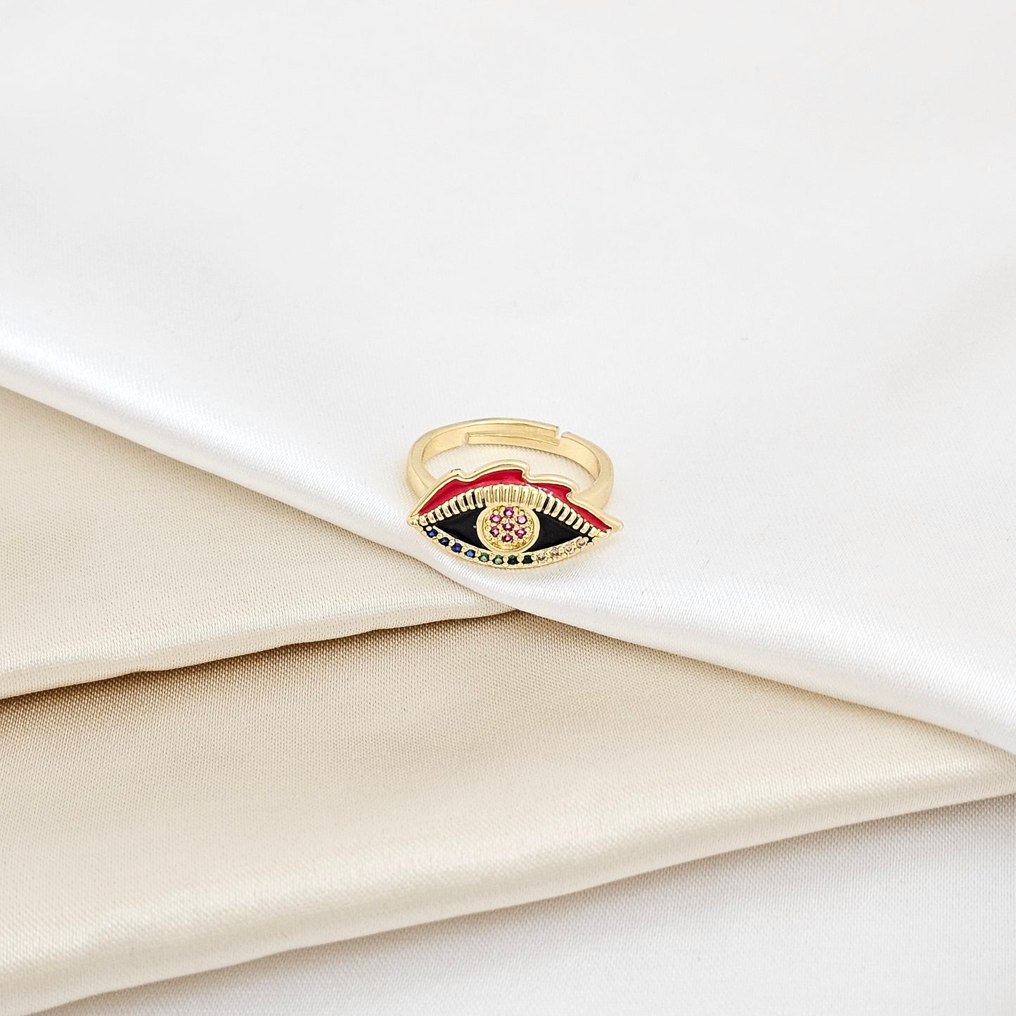 ANILLO DORADO OJO NEGRO CON CIRCONES DE COLORES RF K5647