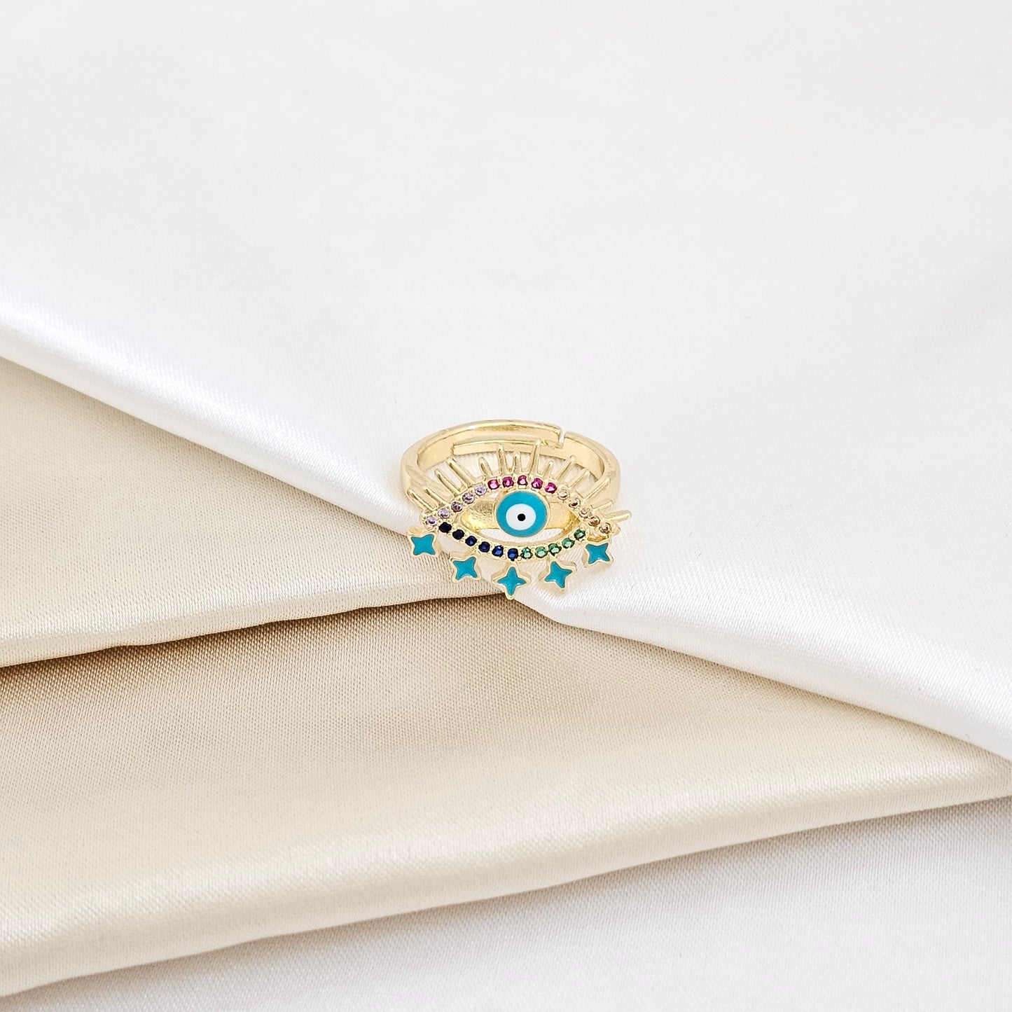 ANILLO DORADO OJO Y ESTRELLAS AZUL CON CIRCONES RF K5648