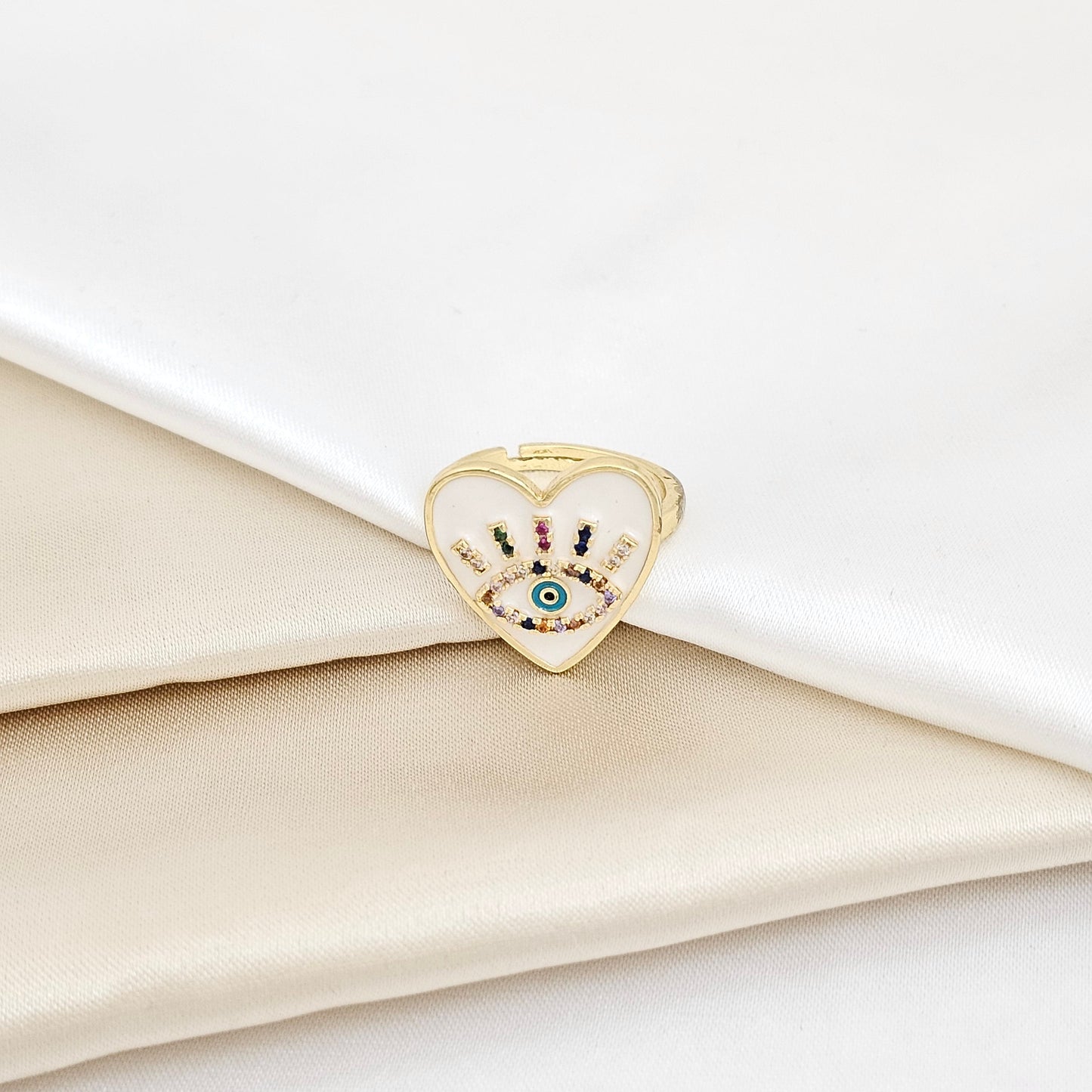 ANILLO DORADO CORAZON BLANCO Y OJO CON CIRCONES RF K5650