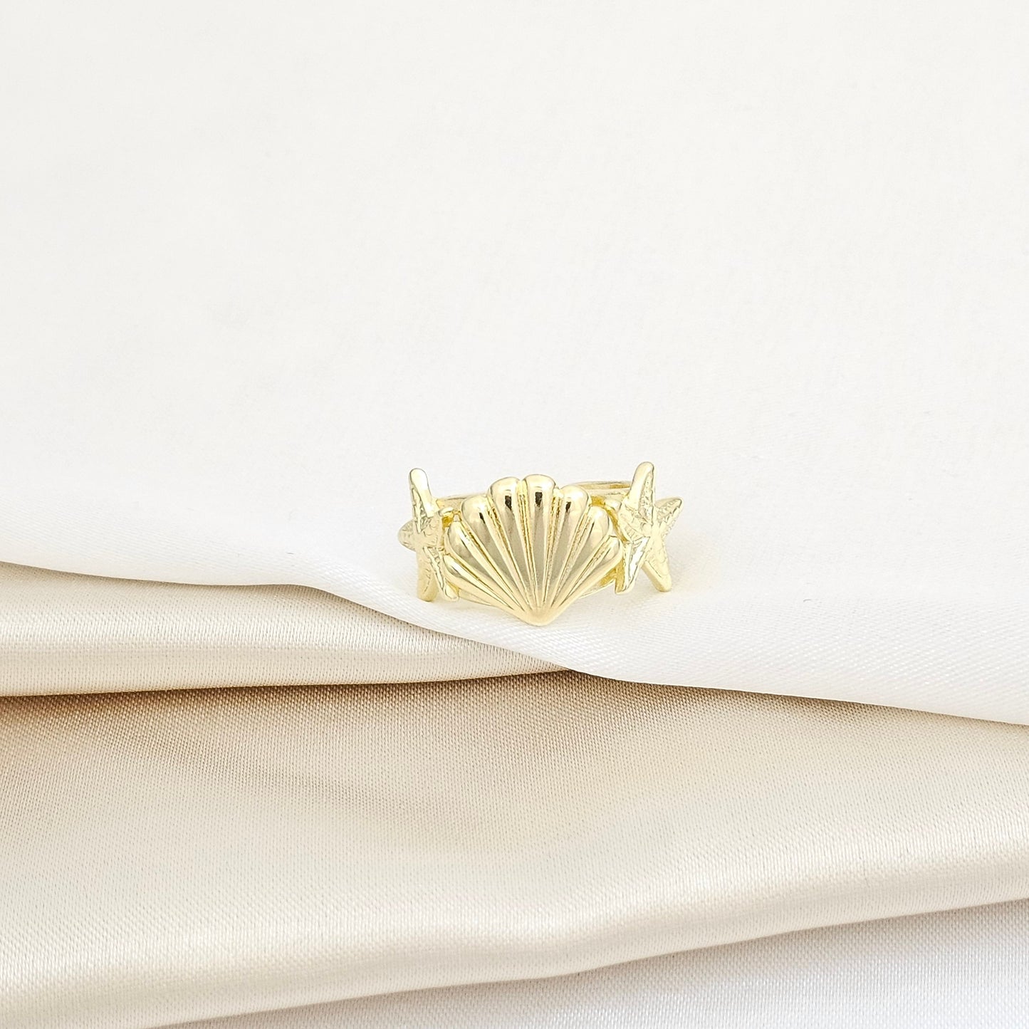 ANILLO ESTRELLAS DE MAR Y CONCHA DORADO RF K5780