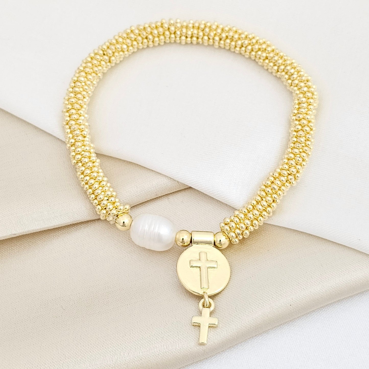 PULSERA FLEXIBLE DORADO CON PERLA Y DIJE DOBLE CRUZ RF K7501