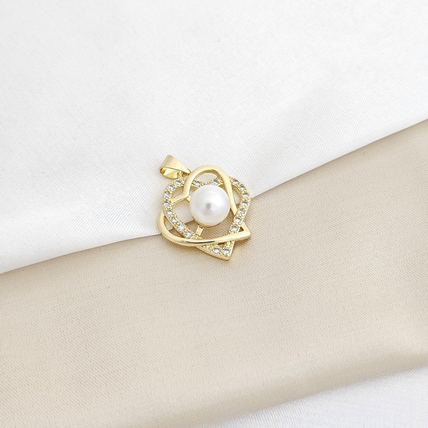 DIJE CORAZON DOBLE CON PERLA DORADO RF K3295