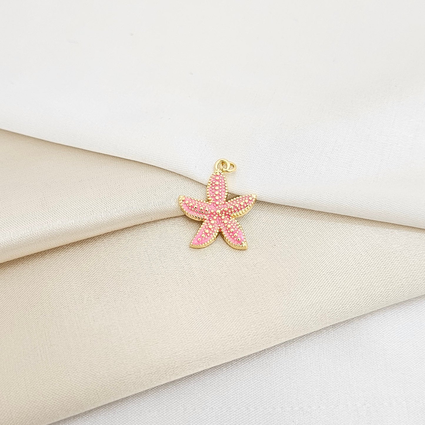 DIJE ESTRELLA DE MAR ROSA Y DORADO RF K7133