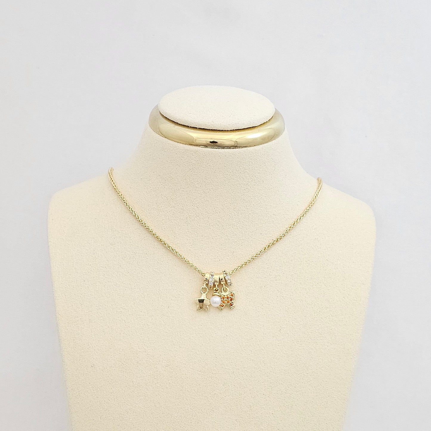 DIJE MARIPOSA PERLA Y ESTRELLA DORADO RF K7550