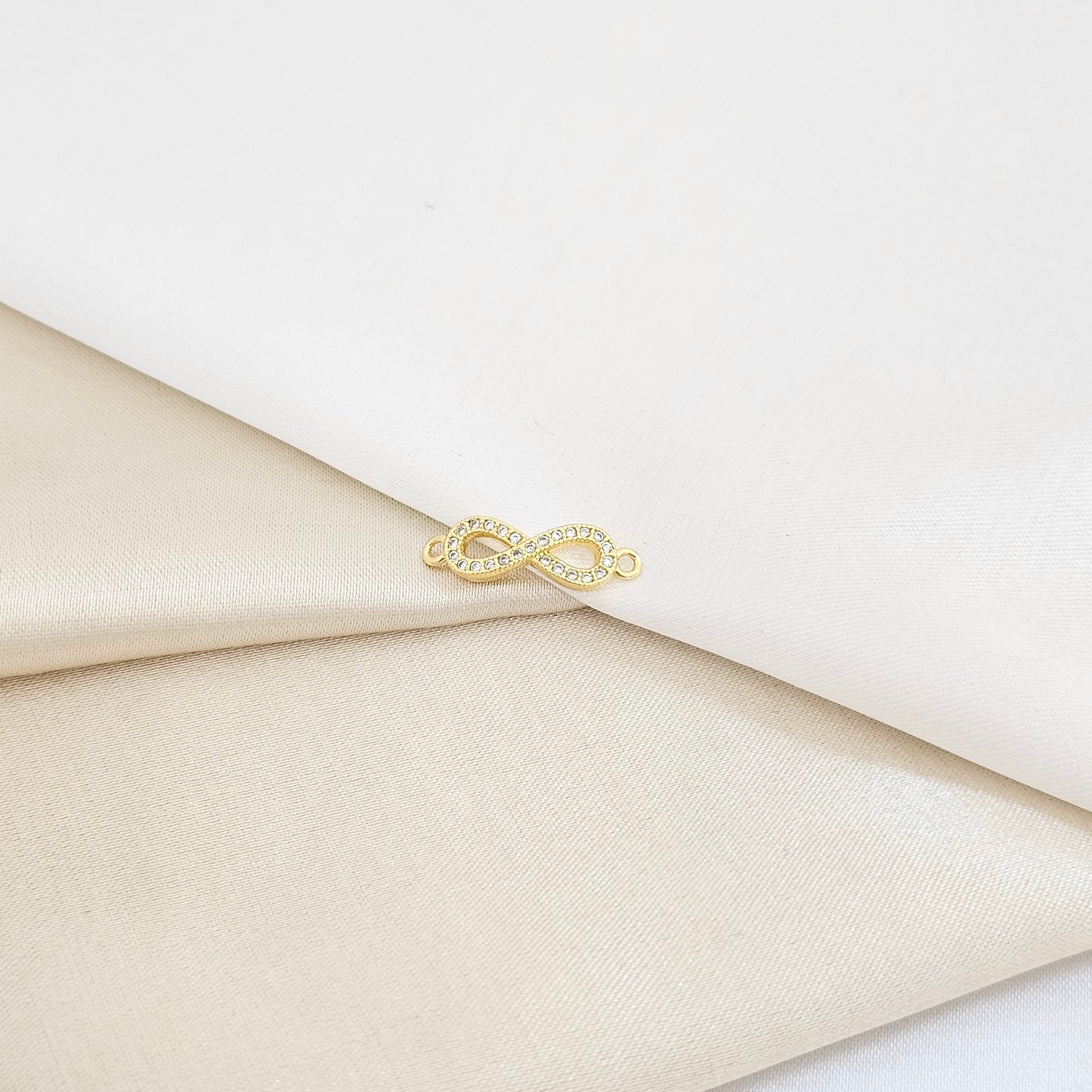 HERRAJE INFINITO CON CIRCONIAS LAM 18K B/23341