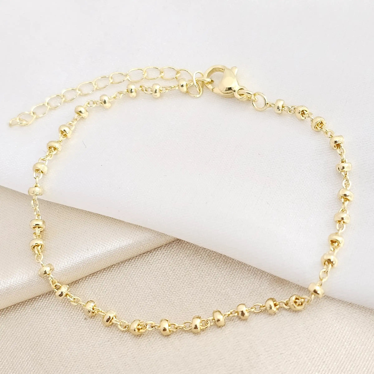 Pulsera Aros Con Balines Ovalados Dorado Rf K7777
