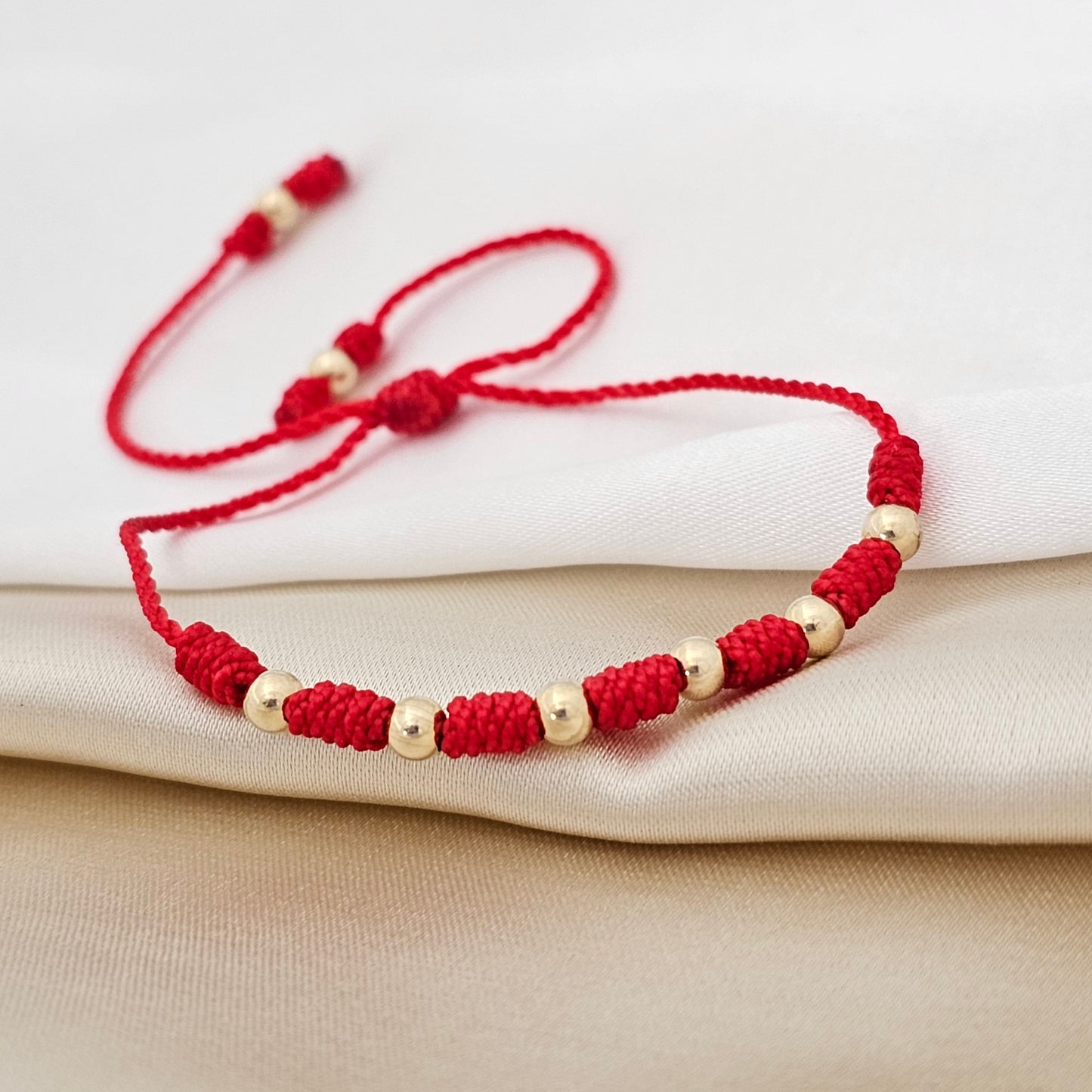 PULSERA GOLD # 4 CON 7 NUDOS ROJA