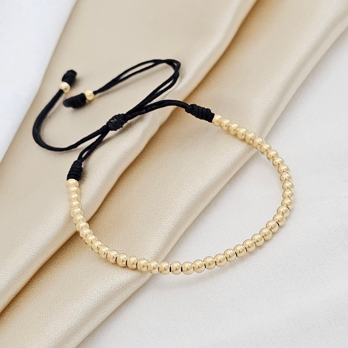 PULSERA GOLD # 3 NEGRA