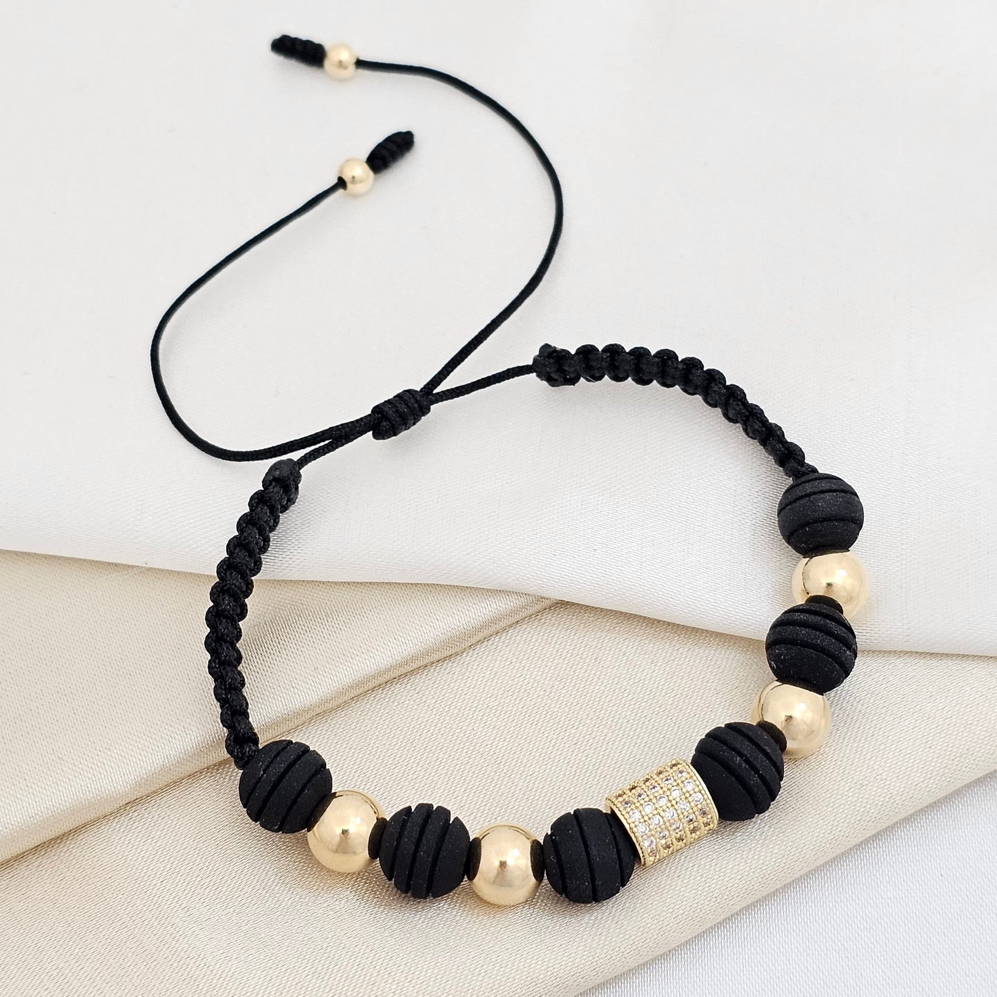 PULSERA GOLD HERRAJE TUBO CIRCON NEGRA