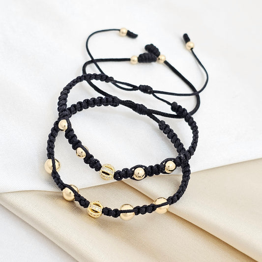 PULSERA GOLD DUO HERRAJE BALL CRISTAL NEGRAS