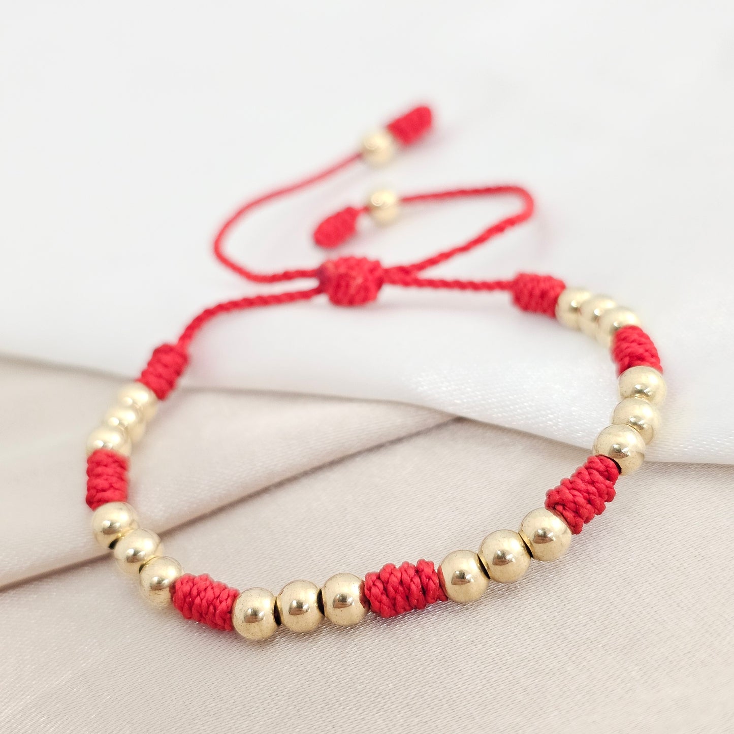 PULSERA GOLD C/ NUDOS #4 ROJA