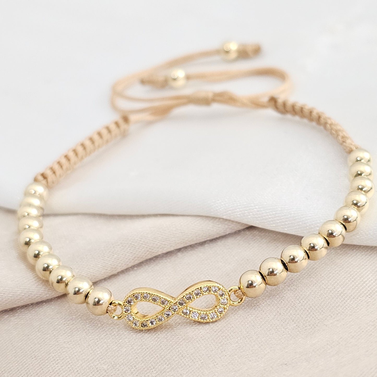 PULSERA GOLD H. INFINITO #4 BEIGE