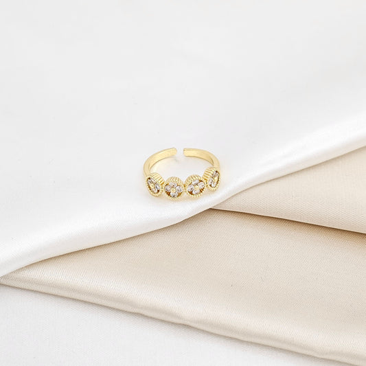 ANILLO CUATRO FLORES CIRCONES DORADO RF K6305
