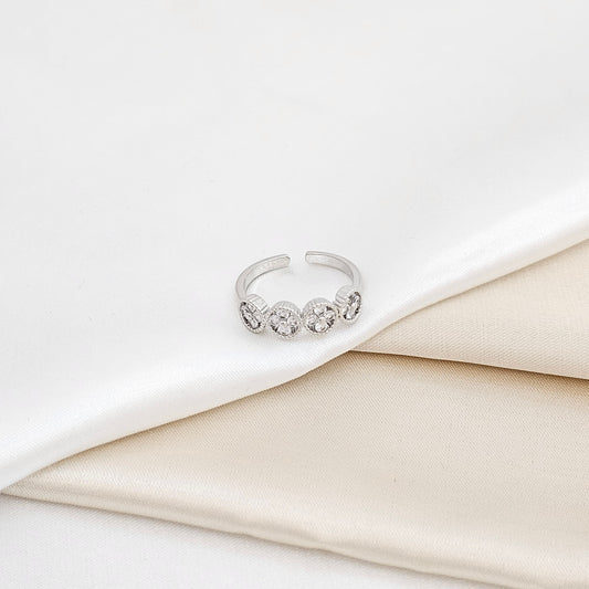ANILLO CUATRO FLORES CIRCONES PLATEADO RF K6306