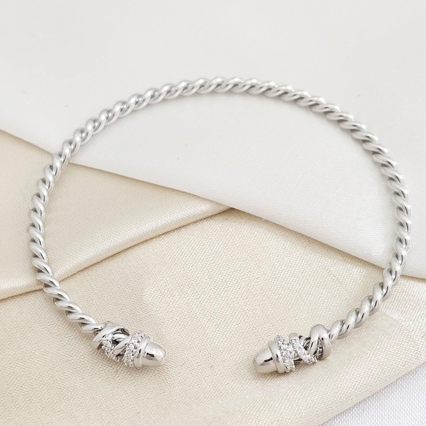 BRAZALETE TRENZA PLATEADO CON CIRCONES RF K7836