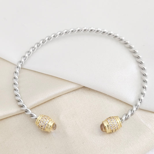 BRAZALETE TRENZA PLATEADO CON CIRCON DORADO RF K7840