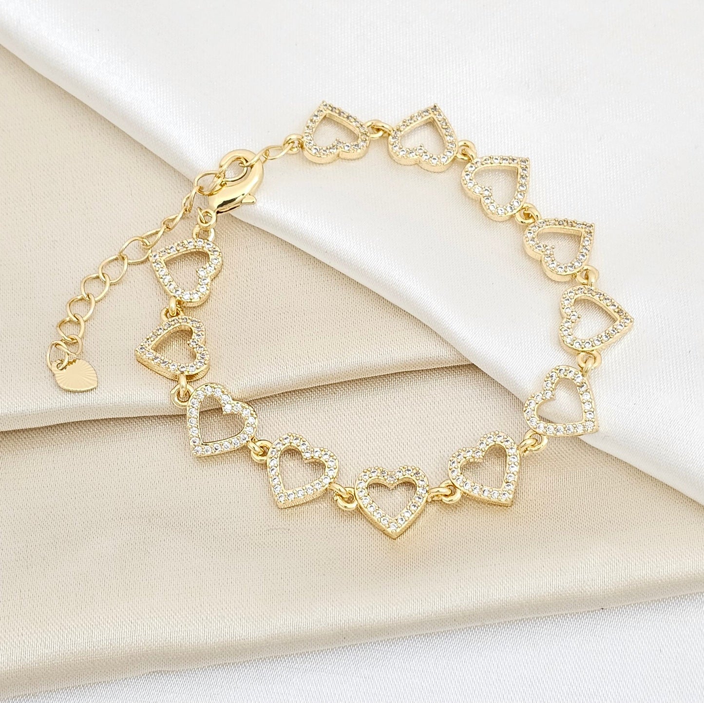 PULSERA CORAZONES CON CIRCONES DORADO RF K5665