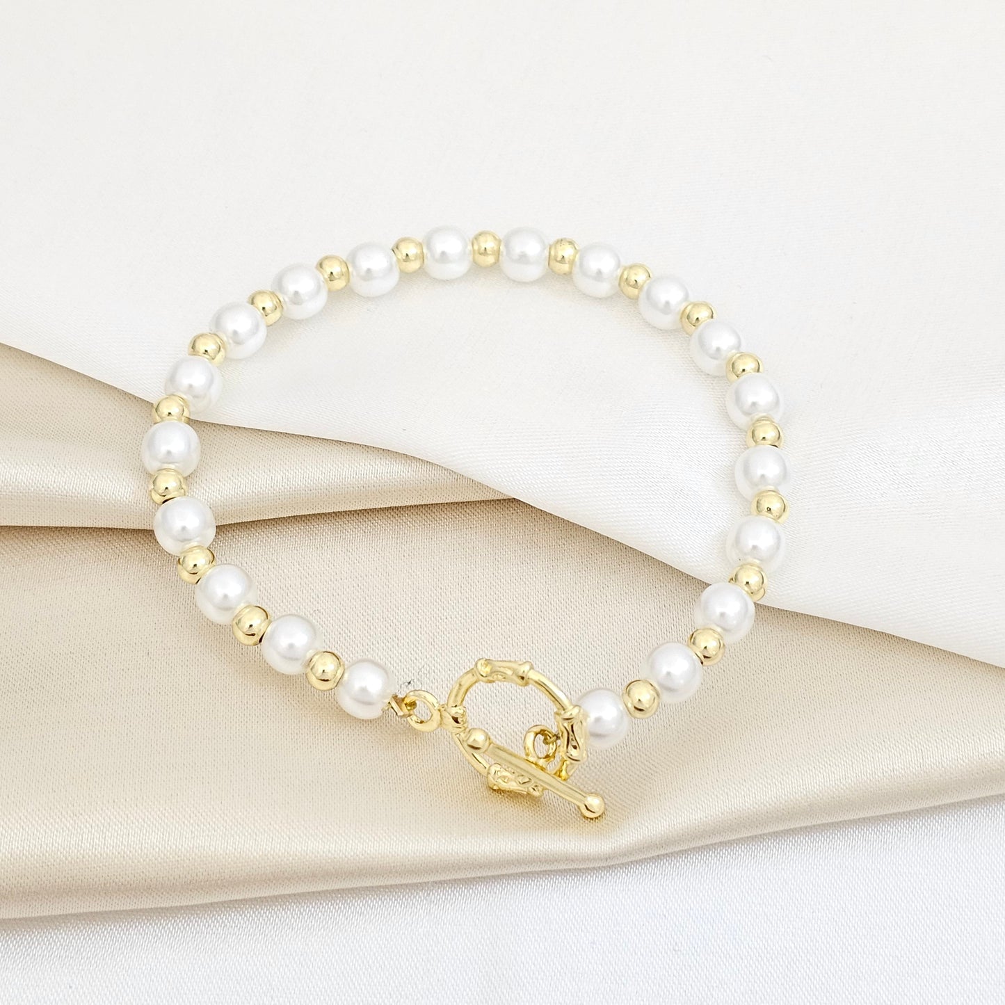 PULSERA PERLAS Y BALINES CON ARO Y BASTON DORADO RF K5751