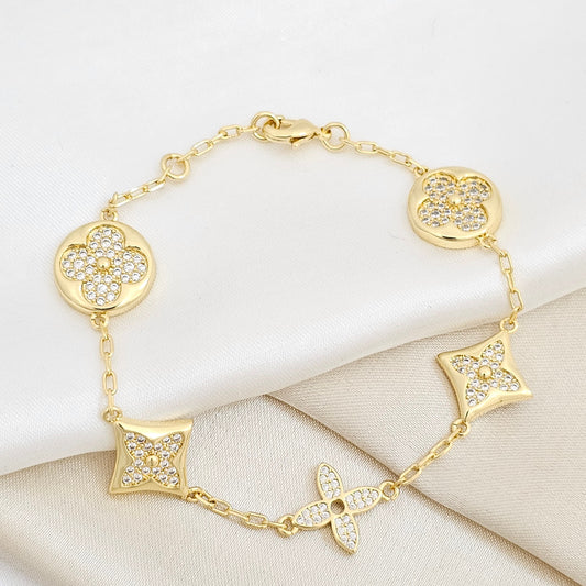 PULSERA LV CON CIRCONES DORADO RF K6235