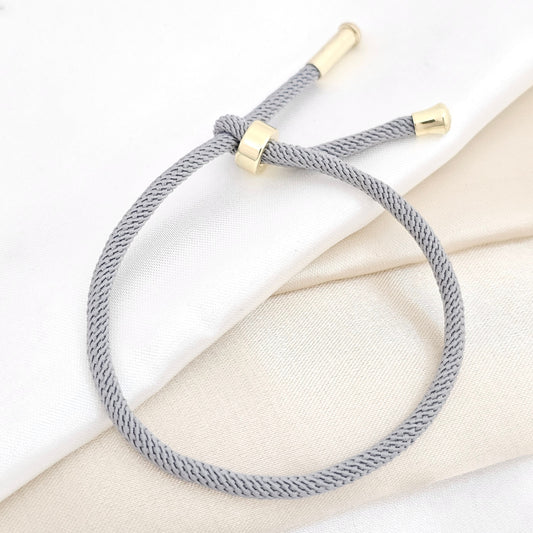 PULSERA BROCHE DORADO CORDON GRIS RF K6400