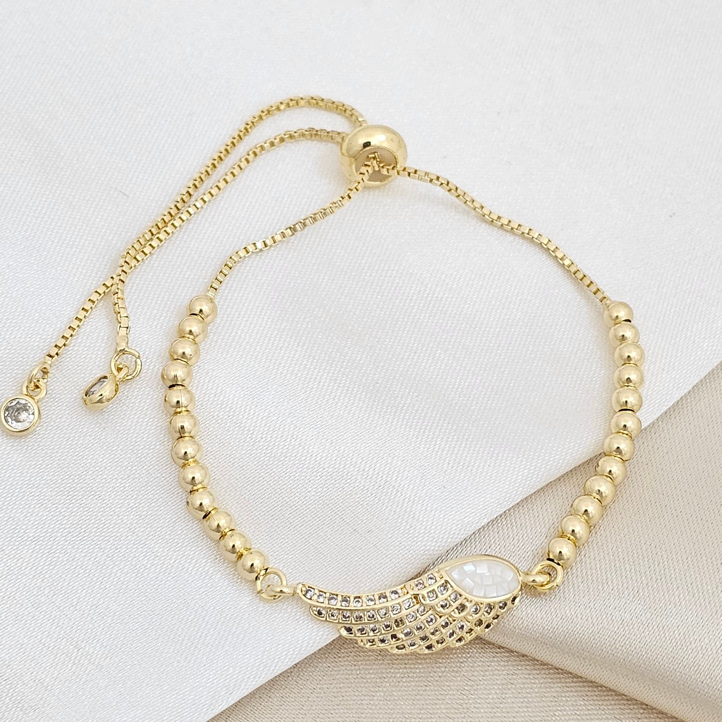 PULSERA CORREDIZA BALINES CON DIJE ALA CIRCONES RF K6733