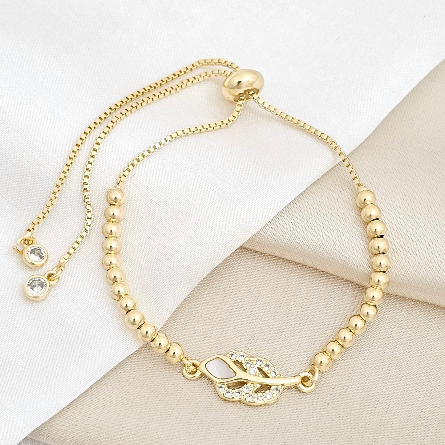 PULSERA CORREDIZA BALINES CON DIJE HOJA CIRCONES Y NACAR RF K6735
