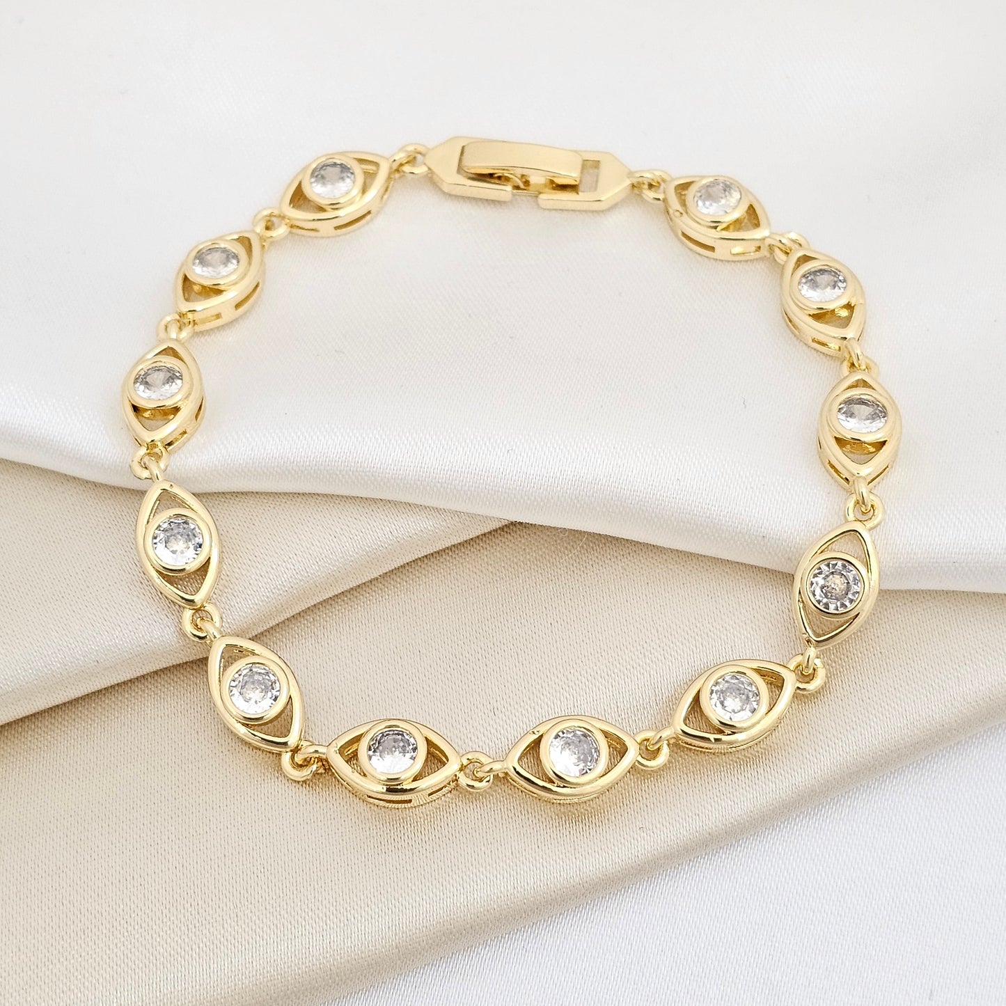 PULSERA OJO VISION CON CIRCONES DORADO RF K7656