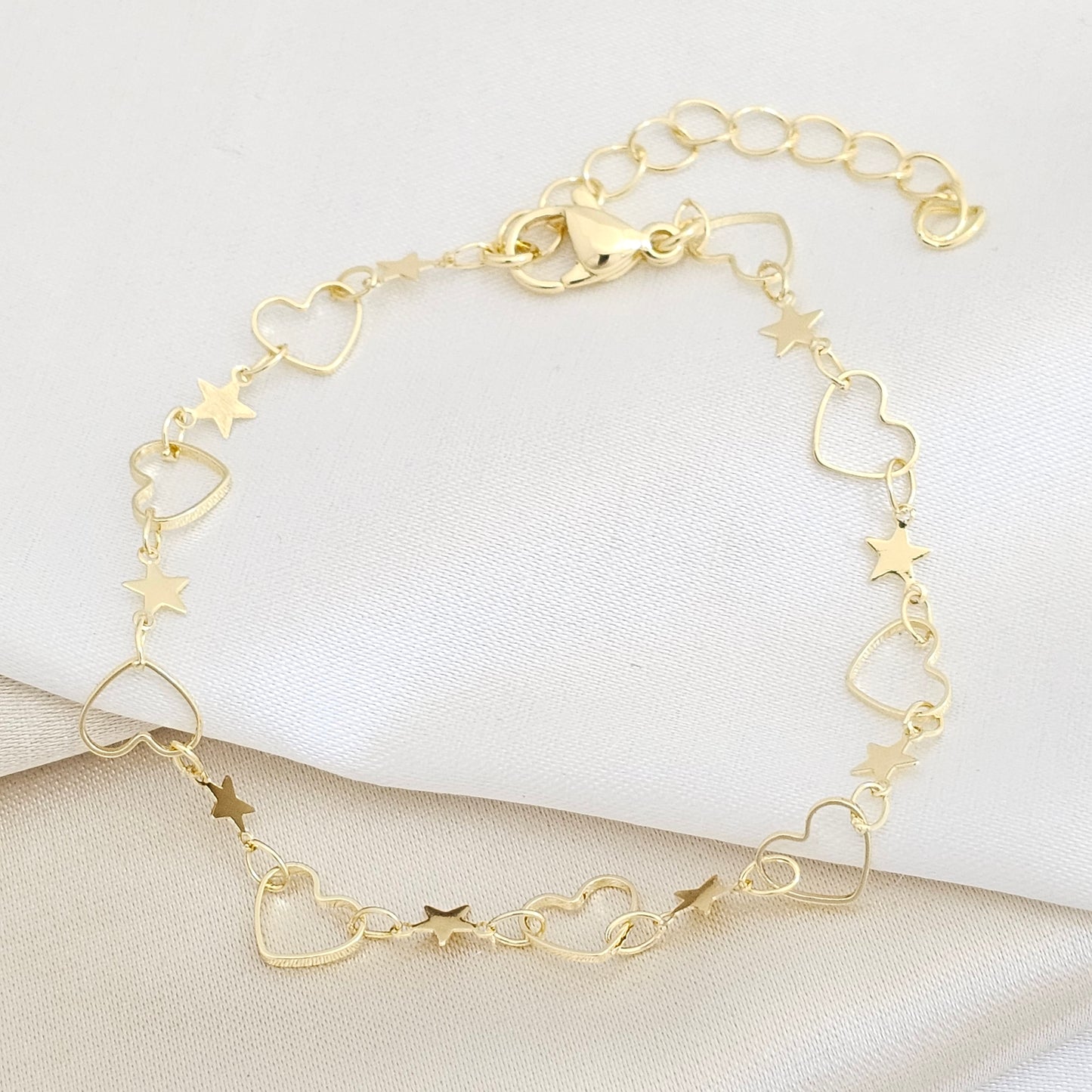 PULSERA CORAZONES Y ESTRELLAS CON EXTENSOR DORADO RF K7691