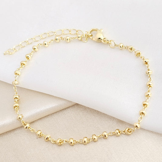 PULSERA AROS CON BALINES OVALADOS DORADO RF K7777
