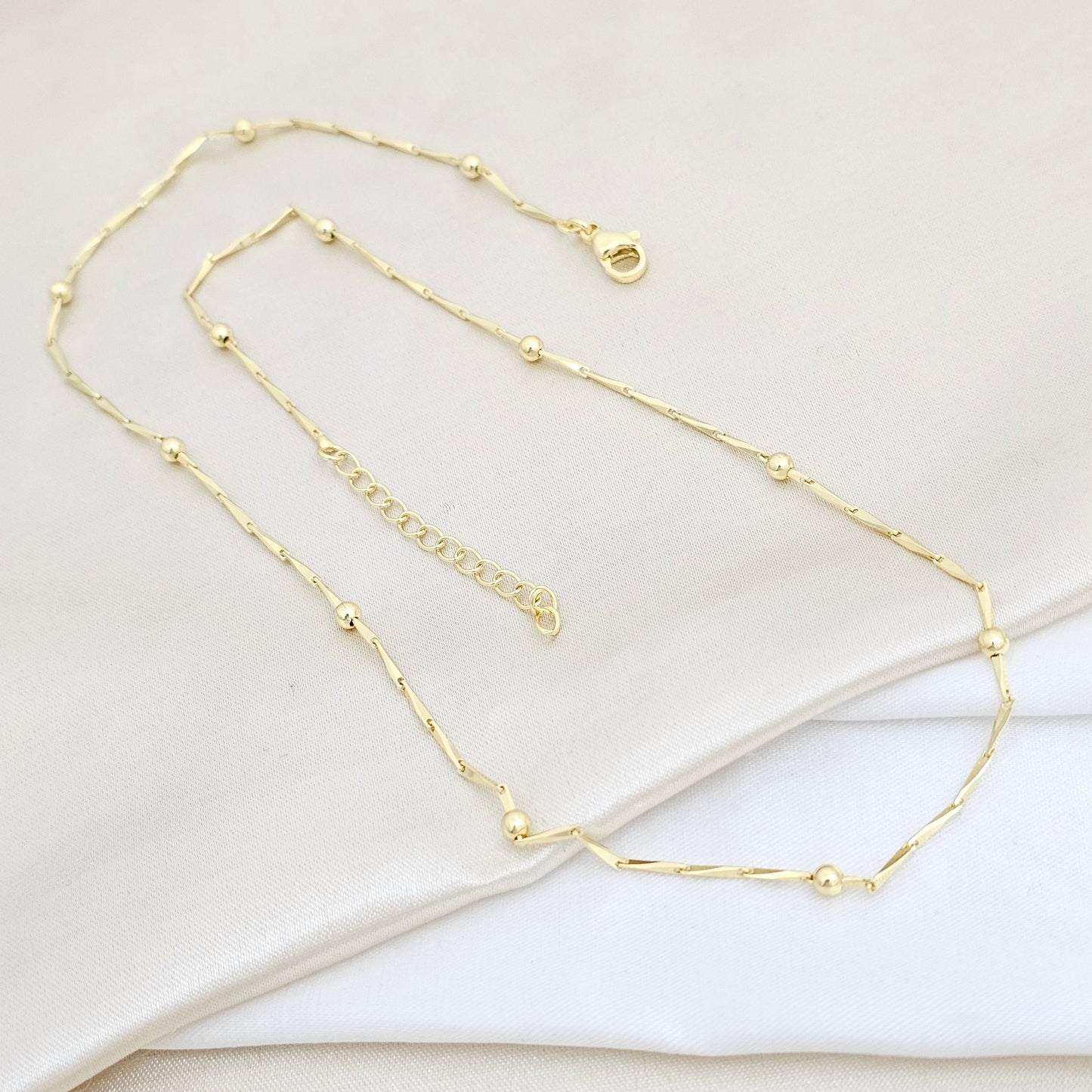 CADENA ELEGANTE CON BALINES EXTENSOR DORADO RF K5808