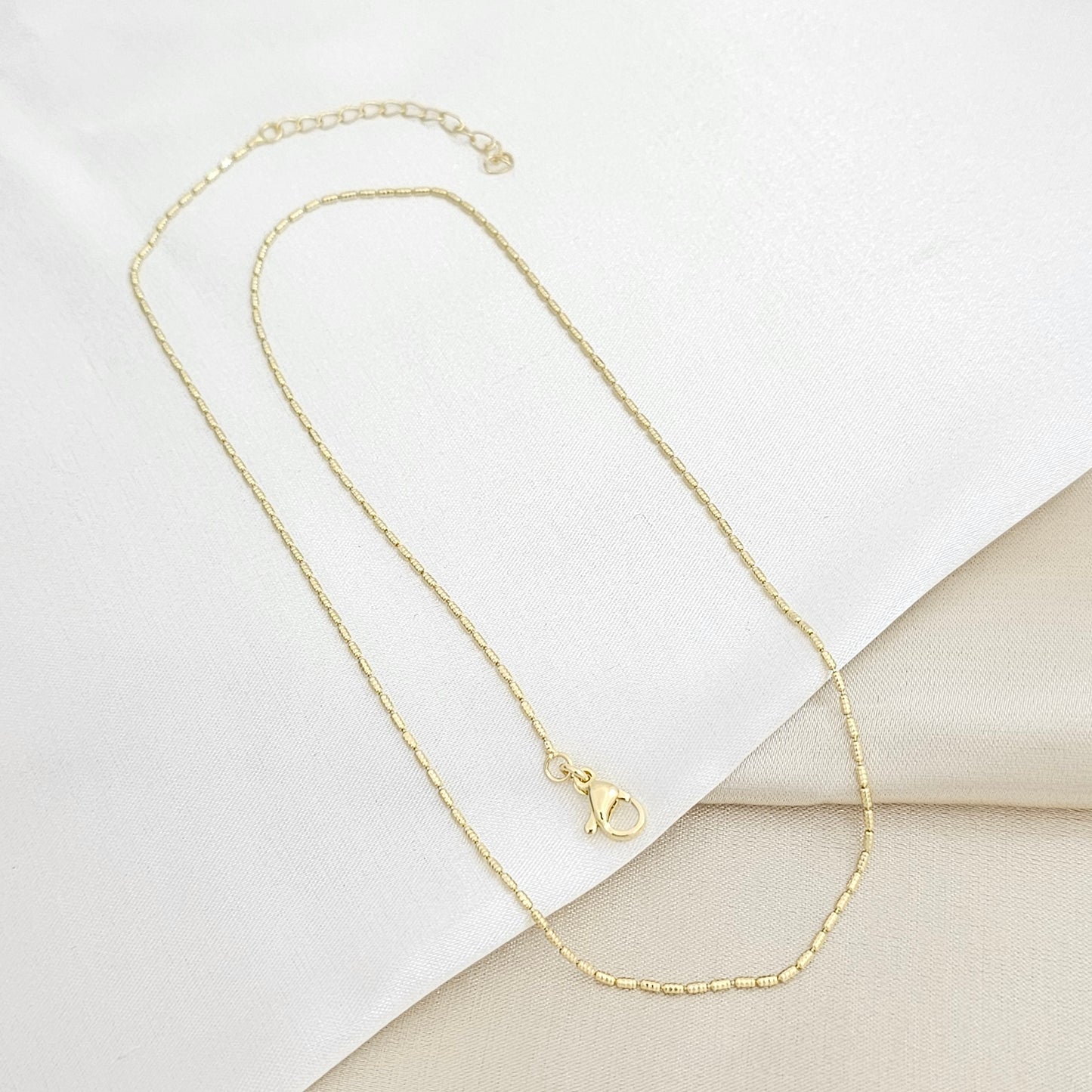CADENA CANUTILLO MINI RAYADO CON EXTENSOR DORADO RF K5911