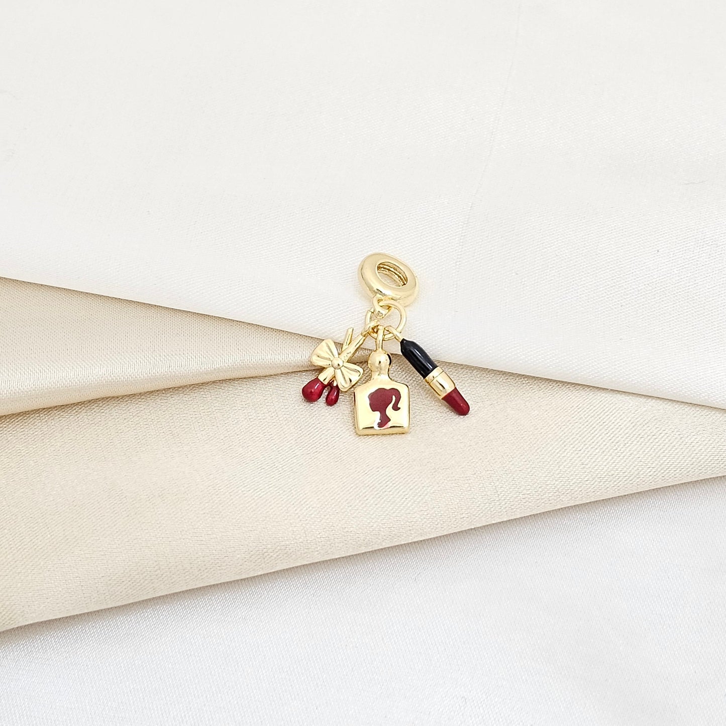 CHARM LABIAL NEGRO Y LOCION ROJA CON DORADO RF K5997