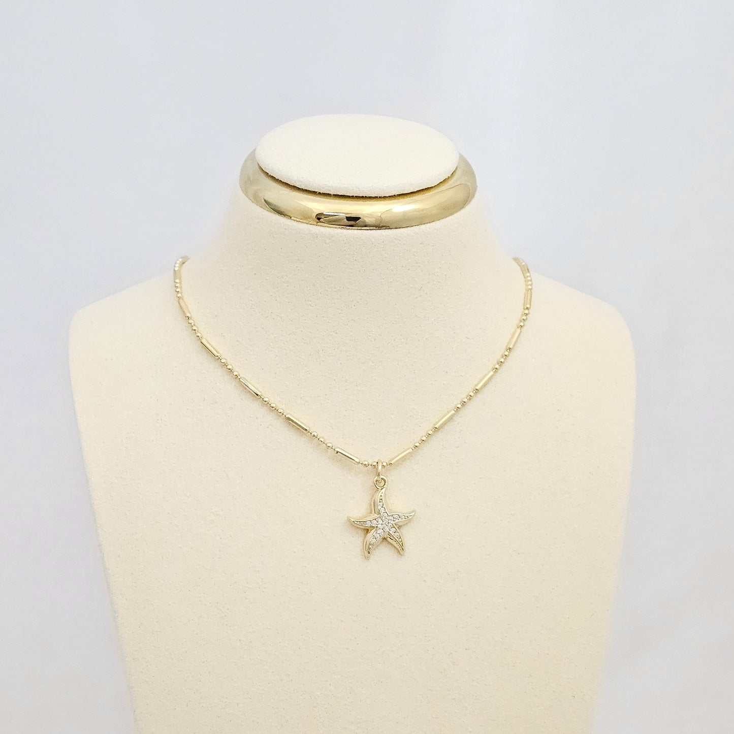 DIJE MINI ESTRELLA LISA Y CIRCONES DORADO RF K6684