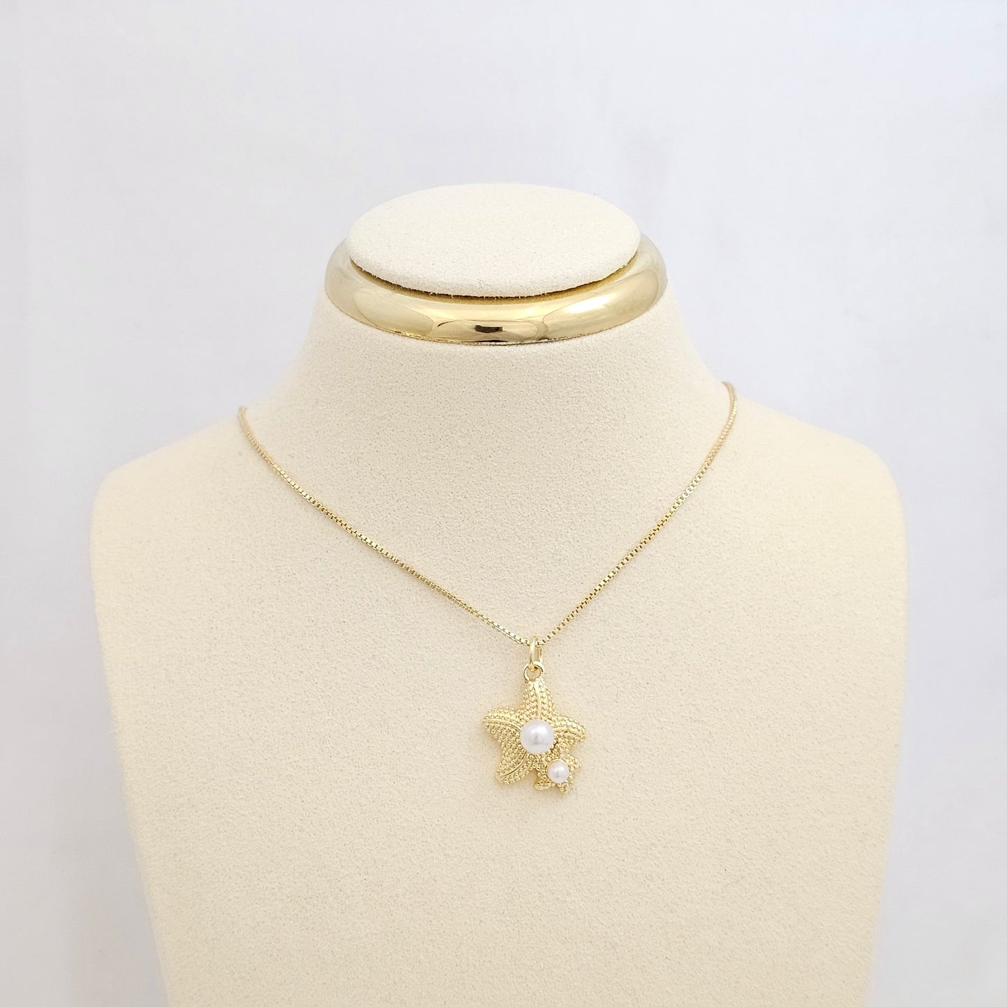 DIJE DOBLE ESTRELLA DE MAR DORADO CON PERLAS RF K7100
