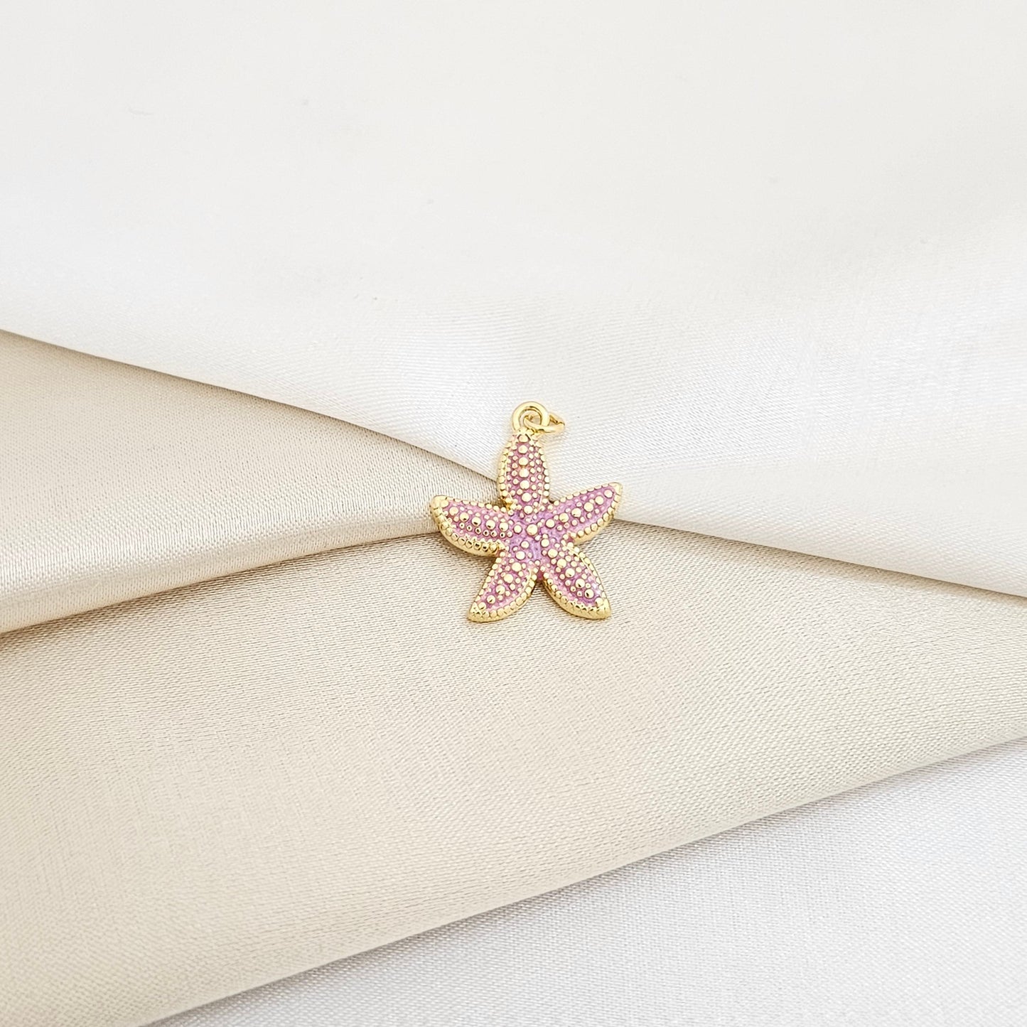 DIJE ESTRELLA DE MAR LILA Y DORADO RF K7134
