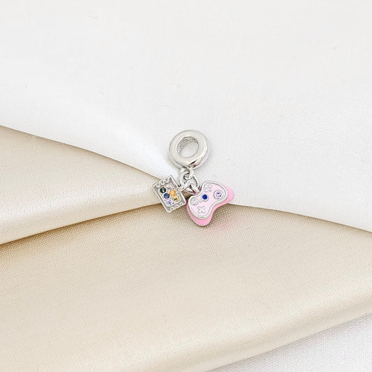 CHARM CONTROL DE VIDEO JUEGOS ROSA Y PLATEADO RF K7285