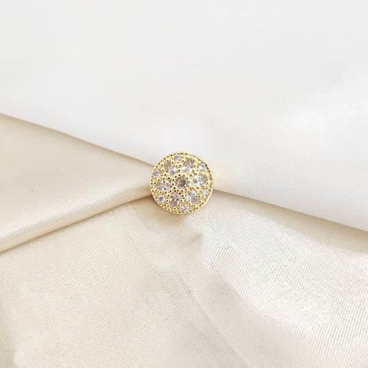 CHARM REDONDO CON FLOR CIRCONES DORADO RF K7789