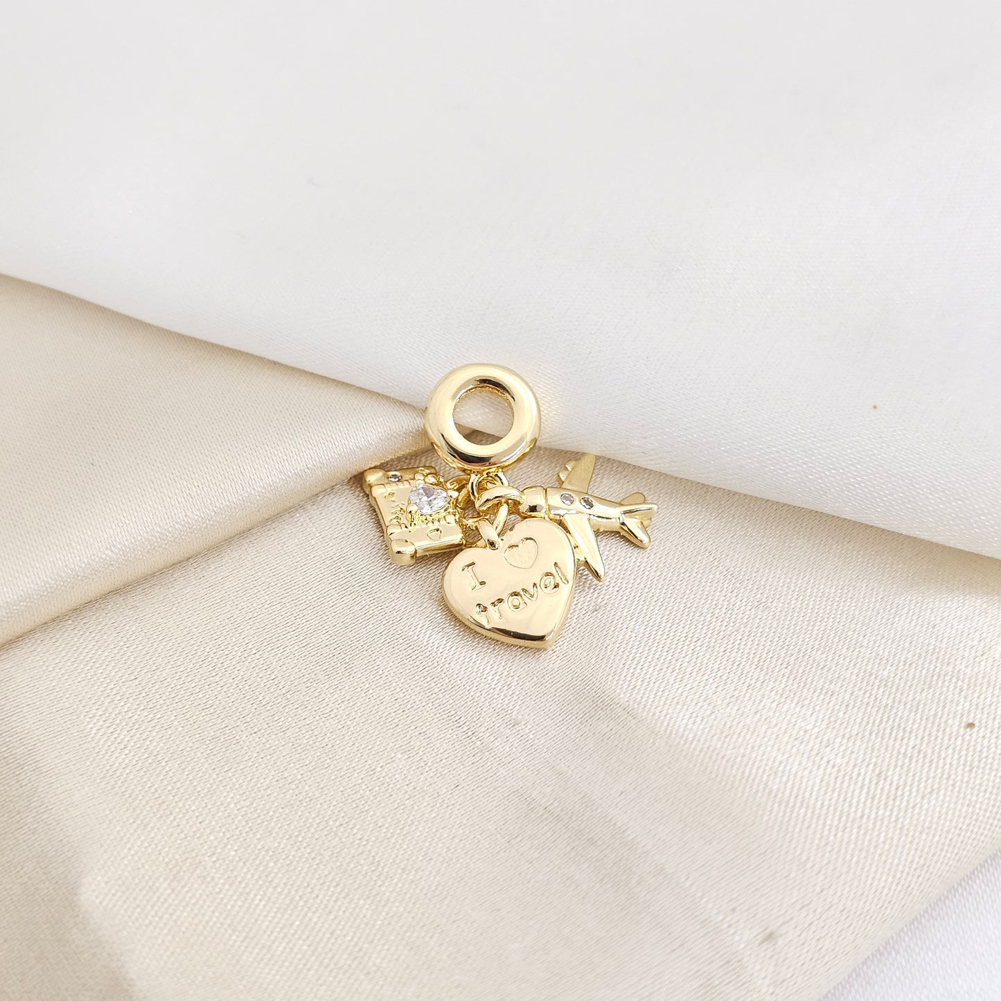 CHARM CORAZON AVION Y MALETA DORADO RF K7793