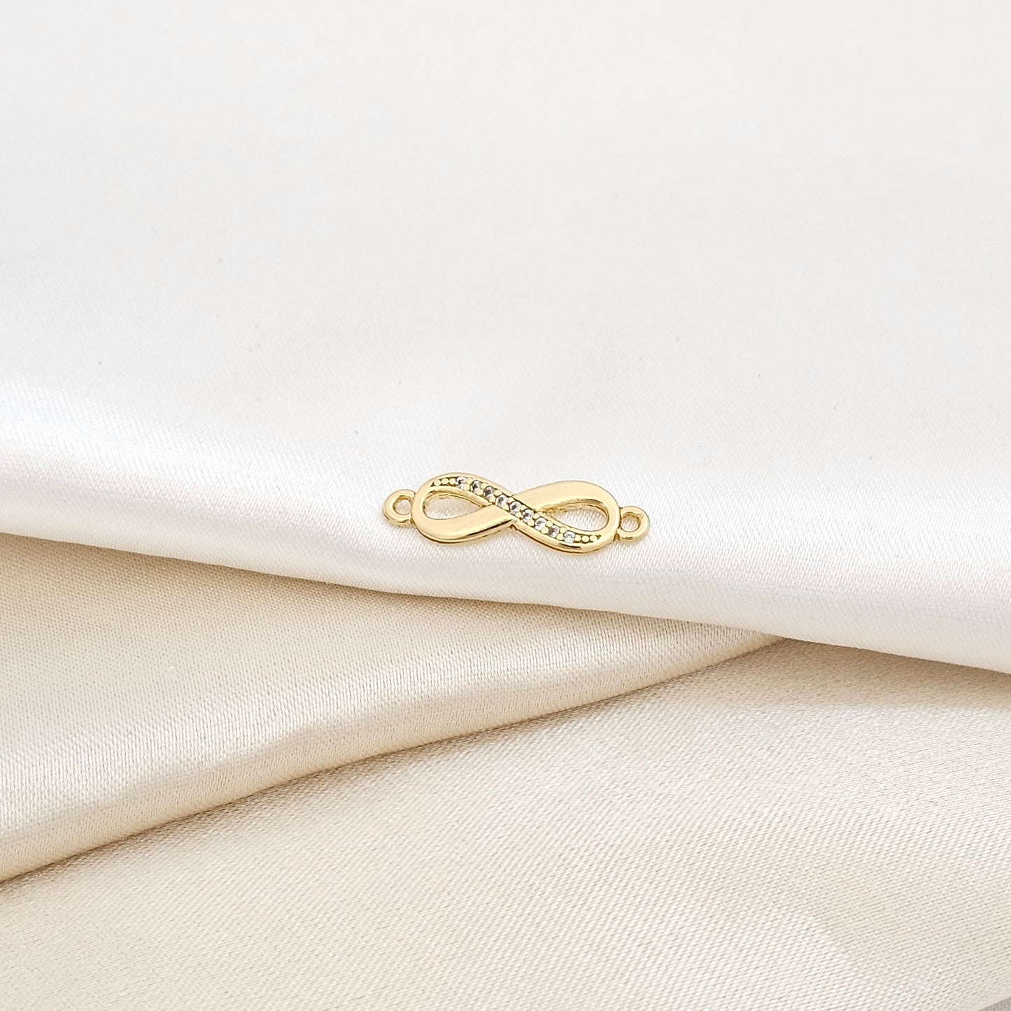 HERRAJE INFINITO 1/2 CIRCONIAS LAM 18K-24343