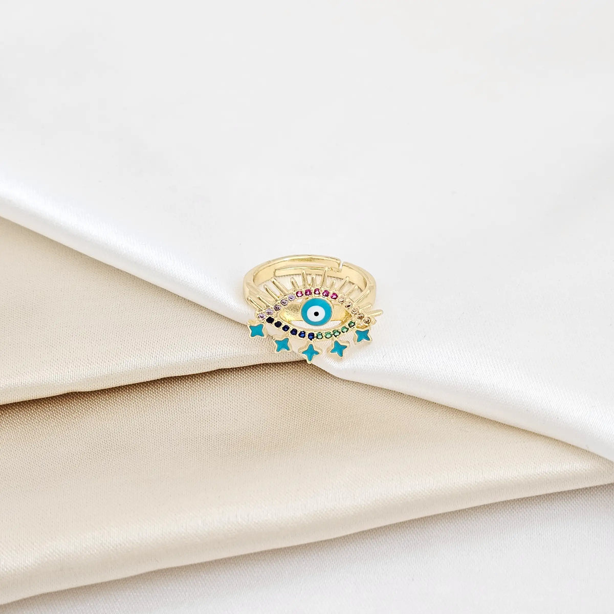 Anillo Dorado Ojo Y Estrellas Azul Con Circones Rf K5648