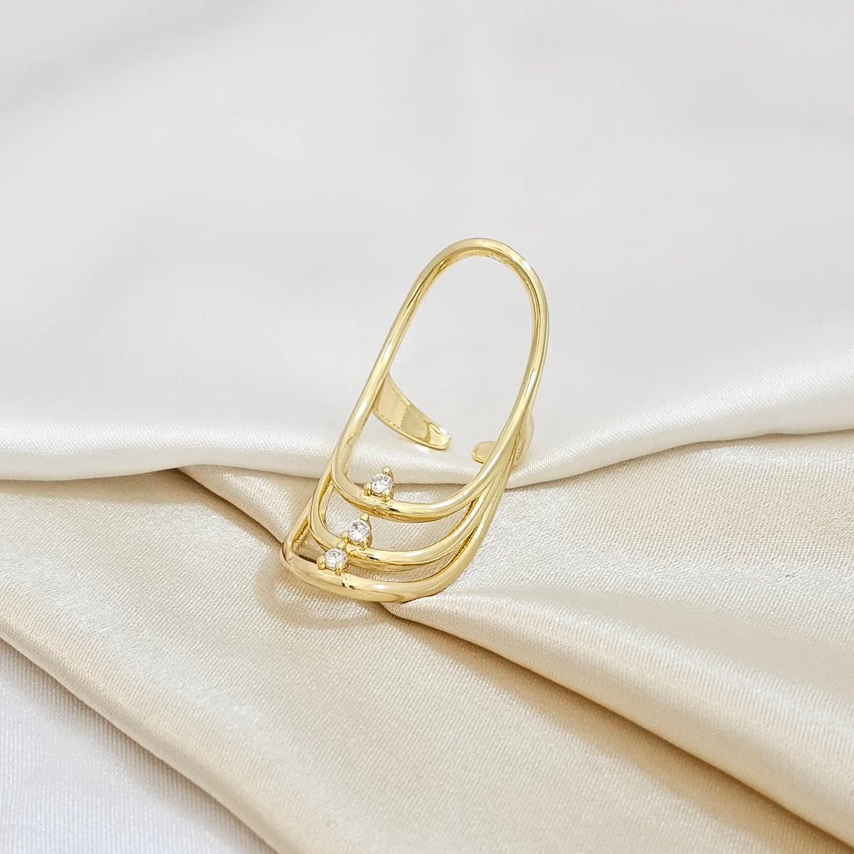 Anillo Tres Lineas Ovaladas Circones Dorado Rf K4153
