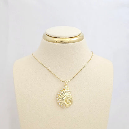 Dije Caracol Dorado Con Perlas Rf K7096
