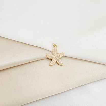 Dije Estrella De Mar Blanco Y Dorado Rf K7132