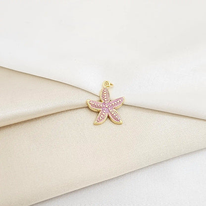 Dije Estrella De Mar Lila Y Dorado Rf K7134