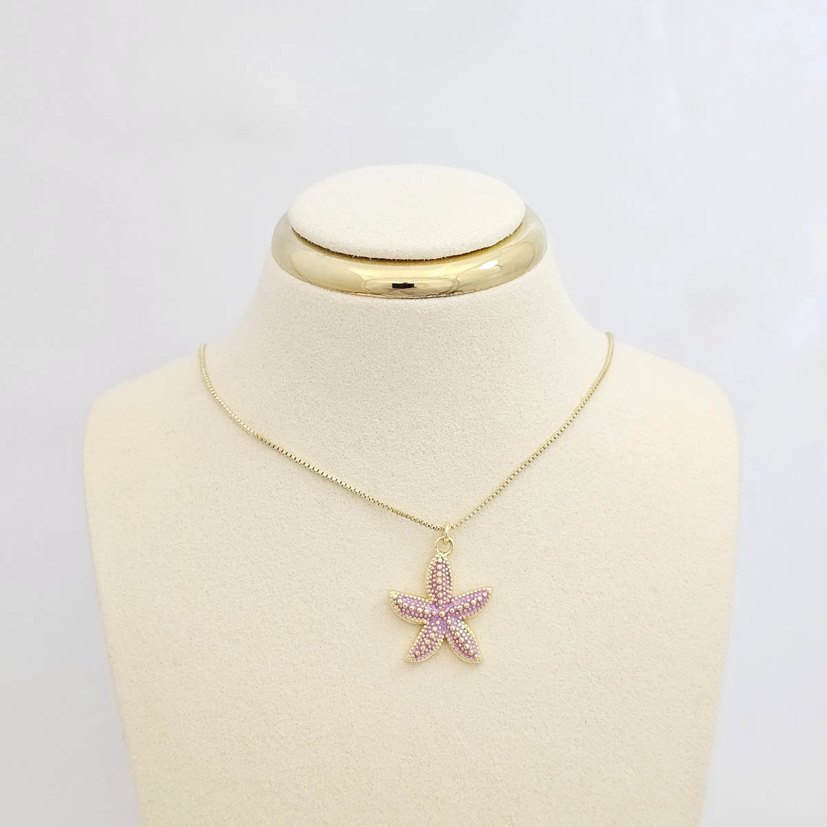 Dije Estrella De Mar Lila Y Dorado Rf K7134