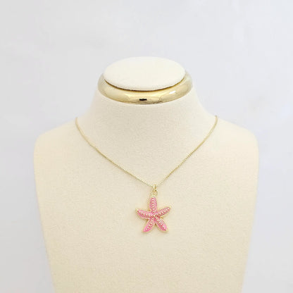 Dije Estrella De Mar Rosa Y Dorado Rf K7133