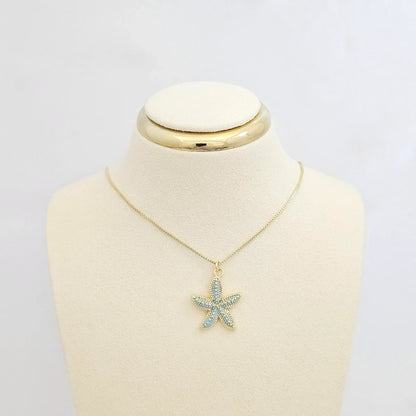 Dije Estrella De Mar Verde Claro Y Dorado Rf K7135