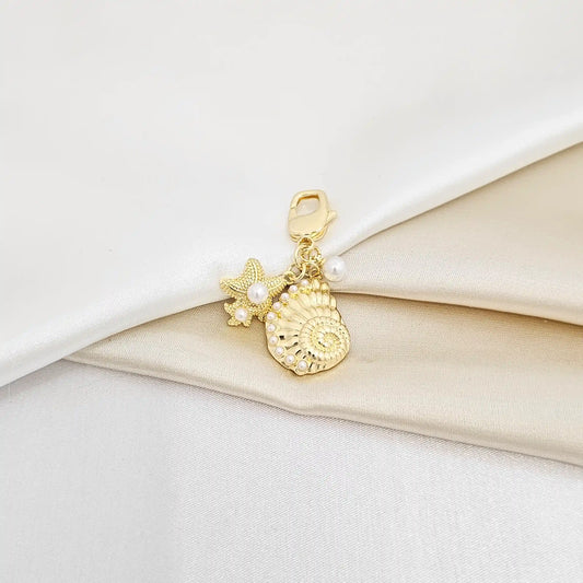 Llavero Caracol Y Estrella De Mar Con Perlas Dorado Rf K6944