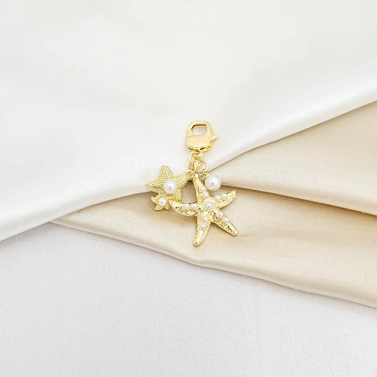 Llavero Doble Estrella De Mar Con Perlas Dorado Rf K6940