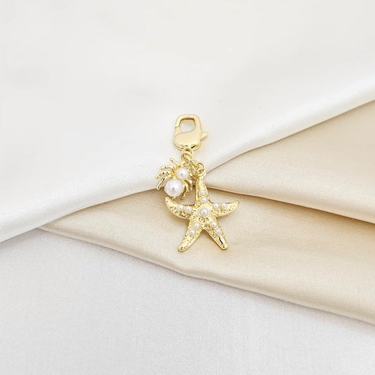 Llavero Estrella De Mar Y Araña Con Perlas Dorado Rf K6939